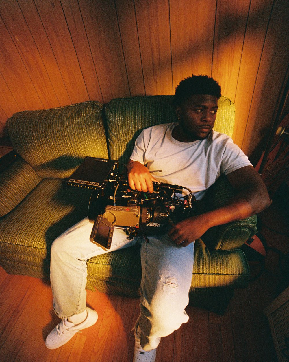 DeAaron Robinson on set operating an ARRI camera